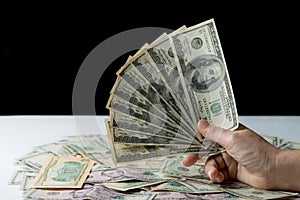 Woman hand holding money,bribery concept.