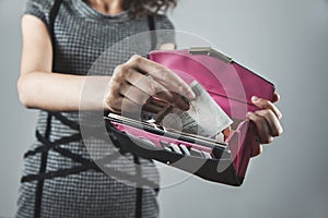 Woman hand holding money with wallet