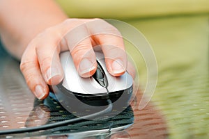 Woman hand holding mouse