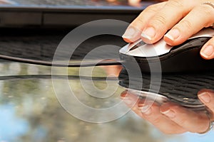 Woman hand holding mouse