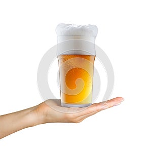 Woman hand holding mug of beer with foam on white background