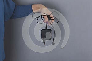 Woman hand holding phone charger
