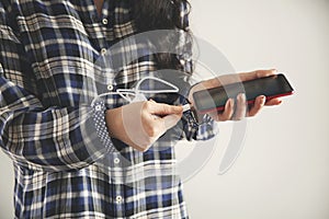 Woman hand holding phone charger