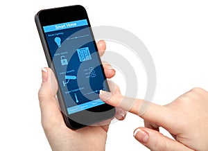 Woman hand holding the phone with system smart house
