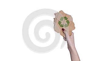 Woman hand holding a piece of carton with recycle sign