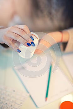 Woman hand holding pills