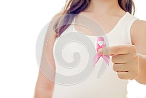 Woman hand holding pink ribbon, breast cancer awareness concept, healthcare and medicine