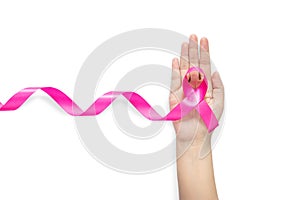 Woman hand holding pink ribbon, Breast cancer awareness symbol. isolated on white background with clipping path.