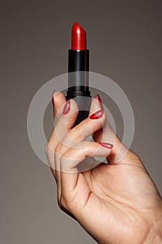 Woman Hand Holding Red Lipstick