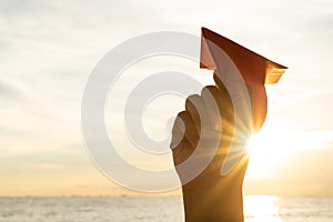 Woman Hand holding red paper rocket with blue sky background