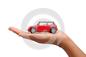 Woman hand holding a red toy car