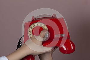 Woman hand vintage phone