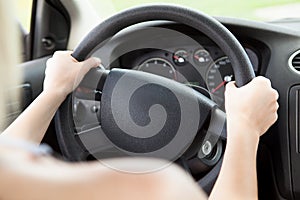 Woman Hand Holding Steering Wheel