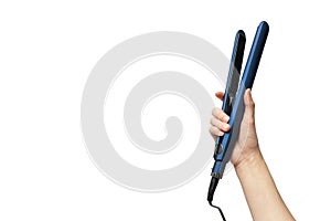 Woman hand holding straightening iron for hairstyle isolated on white background with copy space, horizontal. Haircare