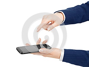 Woman hand holding and touching a mobile phone screen with her t