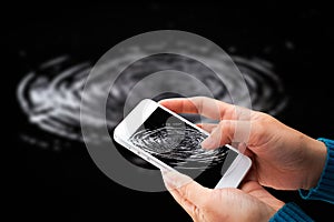 Woman hand holding and using mobile,cell phone,smart phone with isolated screen.