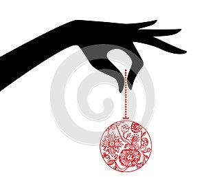 Woman hand holding xmas ball