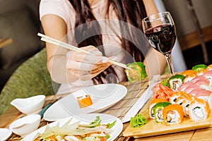 Woman hand with Japanese sticks