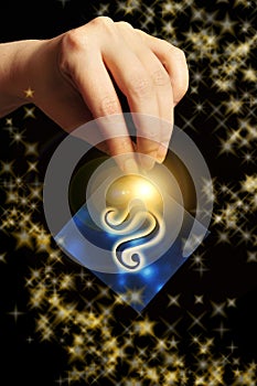 Woman hand keeping a blue card with zodiac symbol of Lion like astrology concept