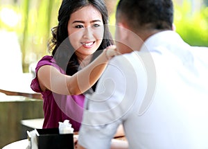 A woman hand kissed by her boyfriend while dating