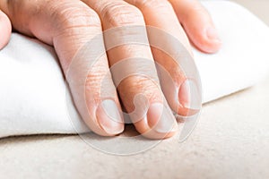 Woman hand with natural unpainted fingernails