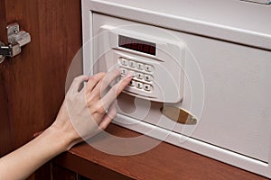 Woman hand opened a safe, close up
