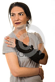 Woman with hand orthosis looking away