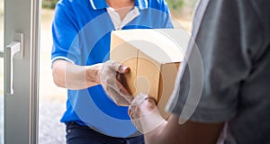 Woman hand pick up the delivery box from deliveryman