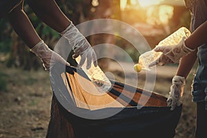 woman hand picking up garbage plastic bottle for cleaning