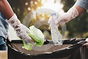 woman hand picking up garbage plastic for cleaning