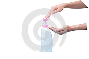 Woman hand pressed on pump cosmetic bottle isolated on white. Shampoo or hair conditioner plastic bottle and dispenser pump. Body