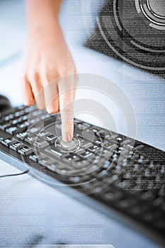 Woman hand pressing on enter button