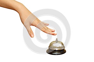 Woman hand pressing a hotel service bell