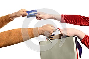 Woman hand pulling the shopping bags, man hand pul