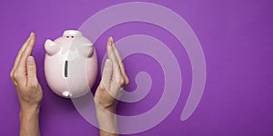 Woman hand putting money coin into piggy for saving money wealth and financial concept