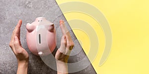 woman hand putting money coin into piggy for saving money wealth and financial concept