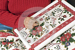 A woman hand quilting