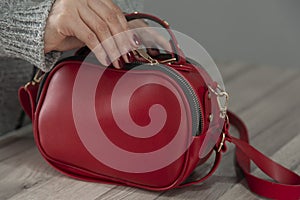 Woman hand red bag