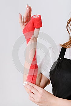 Woman hand with red long patch