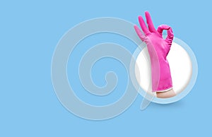 Woman hand in red rubber glove gesturing ok cleaning