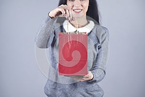 Woman hand red shopping bag