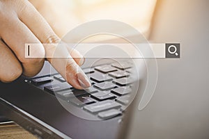 Woman hand searching job on internet with computer