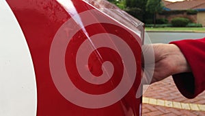 Woman hand sending mail in postbox