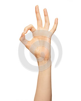 Woman hand show sign ok or okey. Beautiful elegant female hand show gesture finger fine on isolated white