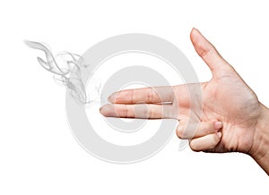 Woman hand showing gun gesture with smoke