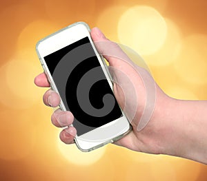Woman hand showing smart phone with isolated screen on an abstract blurred circular bokeh lights background
