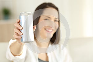 Woman showing a soda refreshment can photo