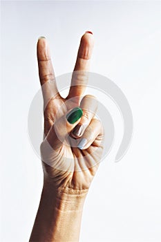 Woman hand sign victory gesture hand stock photo