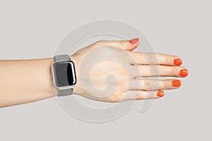 Woman hand with smartwatch with empty display handshaking with partner.