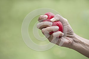 Woman hand squeezing a stress ball